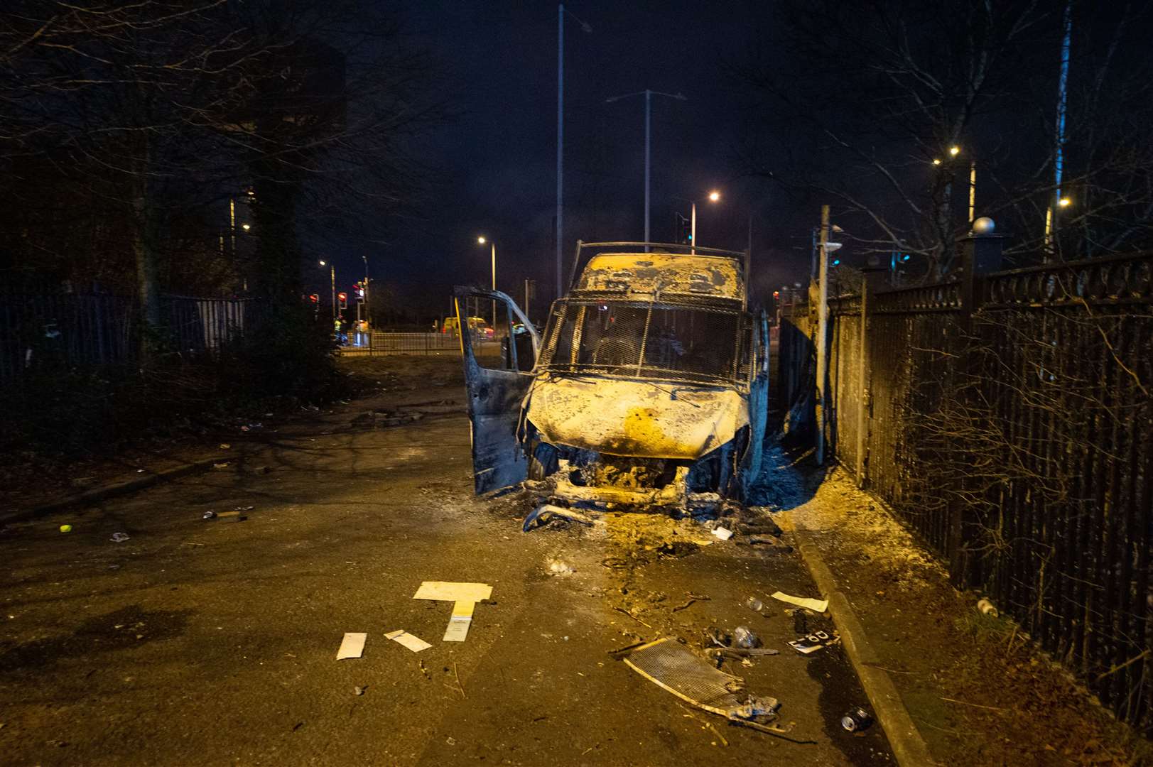 A burnt-out police van after a demonstration outside the Suites Hotel in Knowsley (Peter Powell/PA)