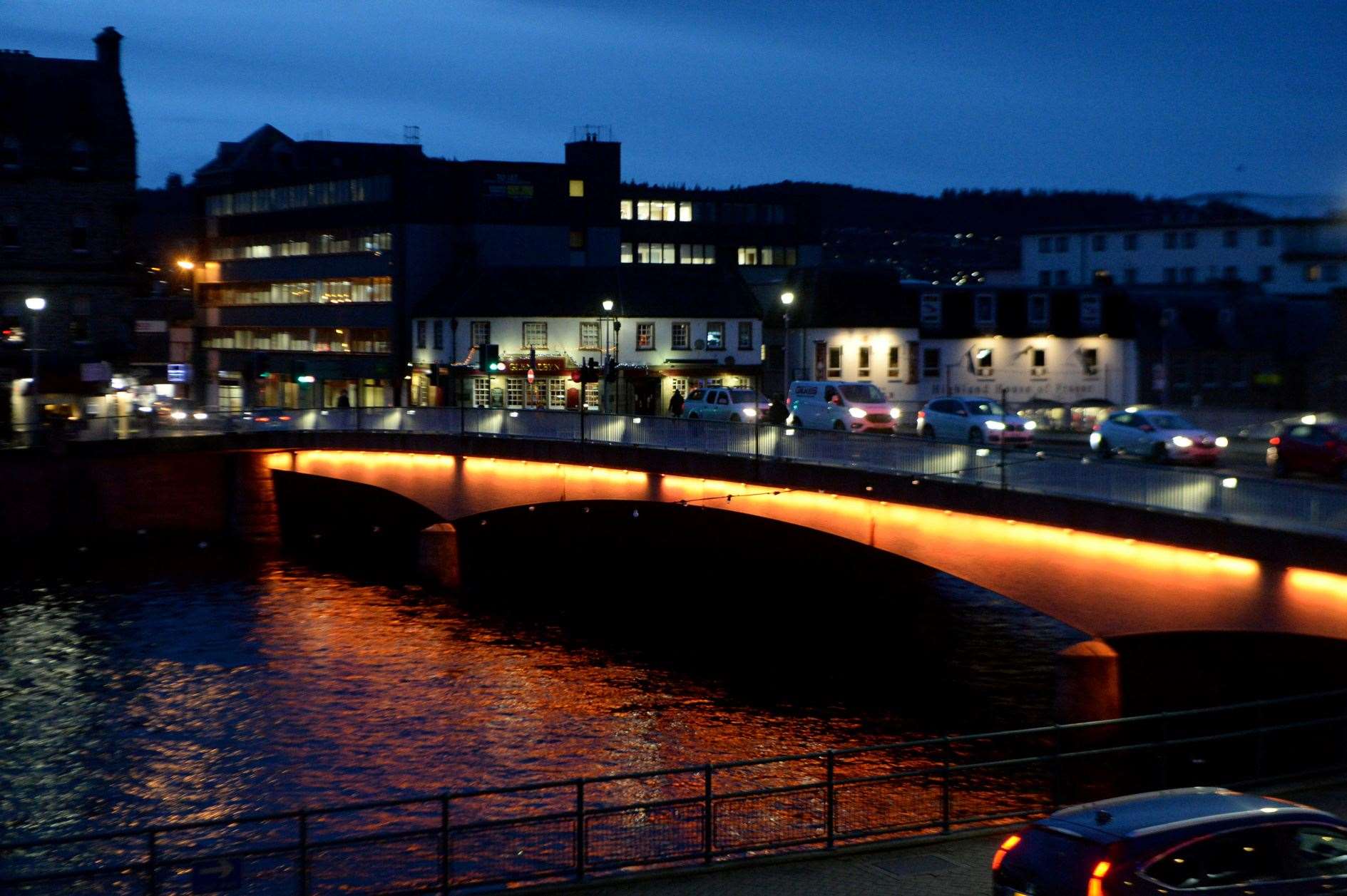 Ness Bridge lit up orange for 16 Days of Activism for the Highland Voice Against Women Partnership. Picture: James Mackenzie