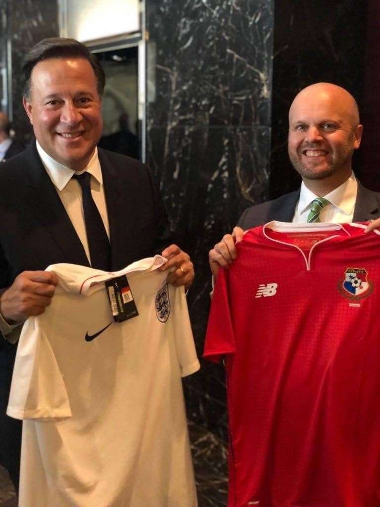 Former British diplomat Damion Potter poses with the Panamanian President holding panama and England shirts (Damion Potter/PA)