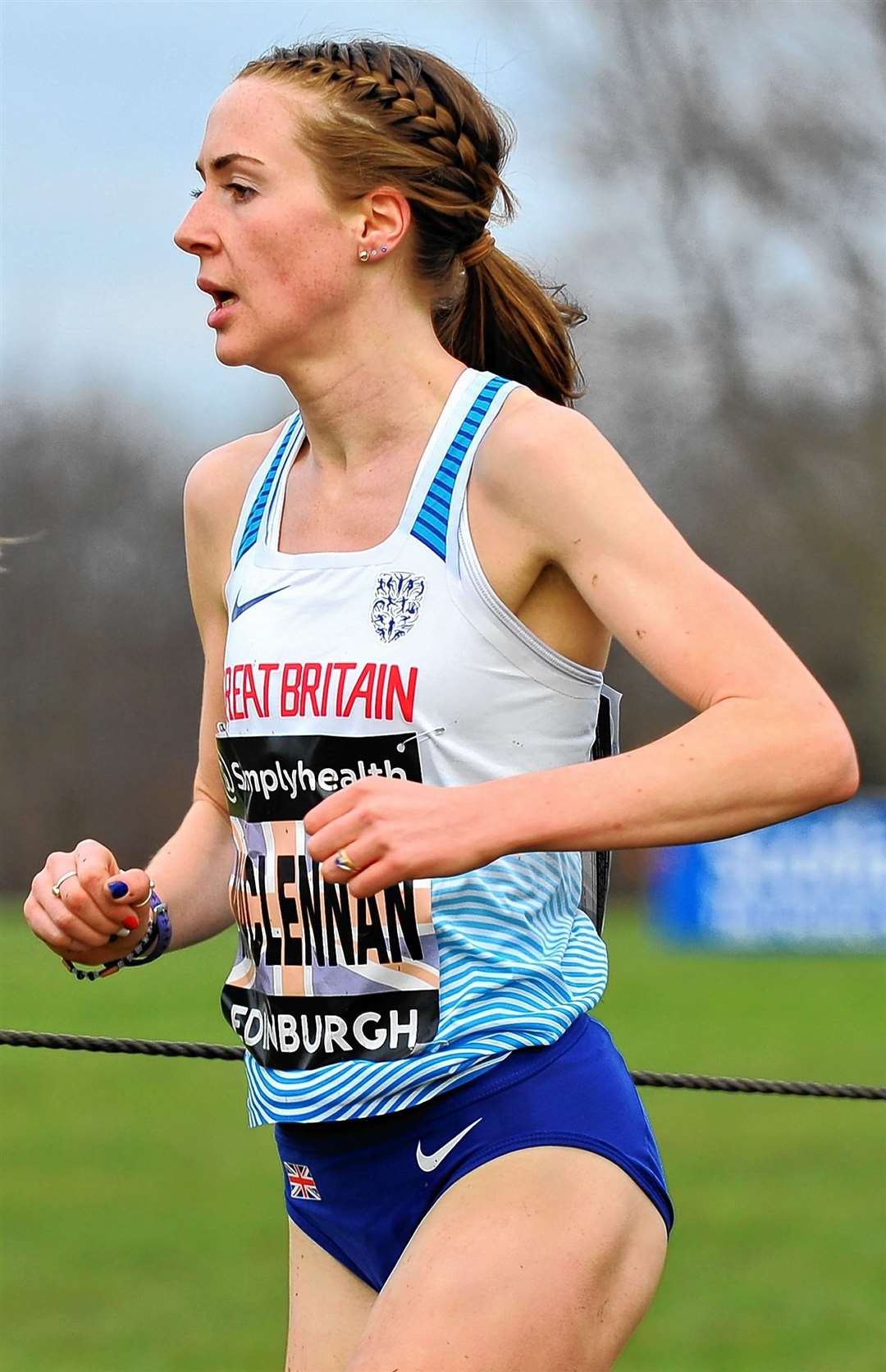 Mhairi Maclennan set a new personal best on her track debut for Great Britain.