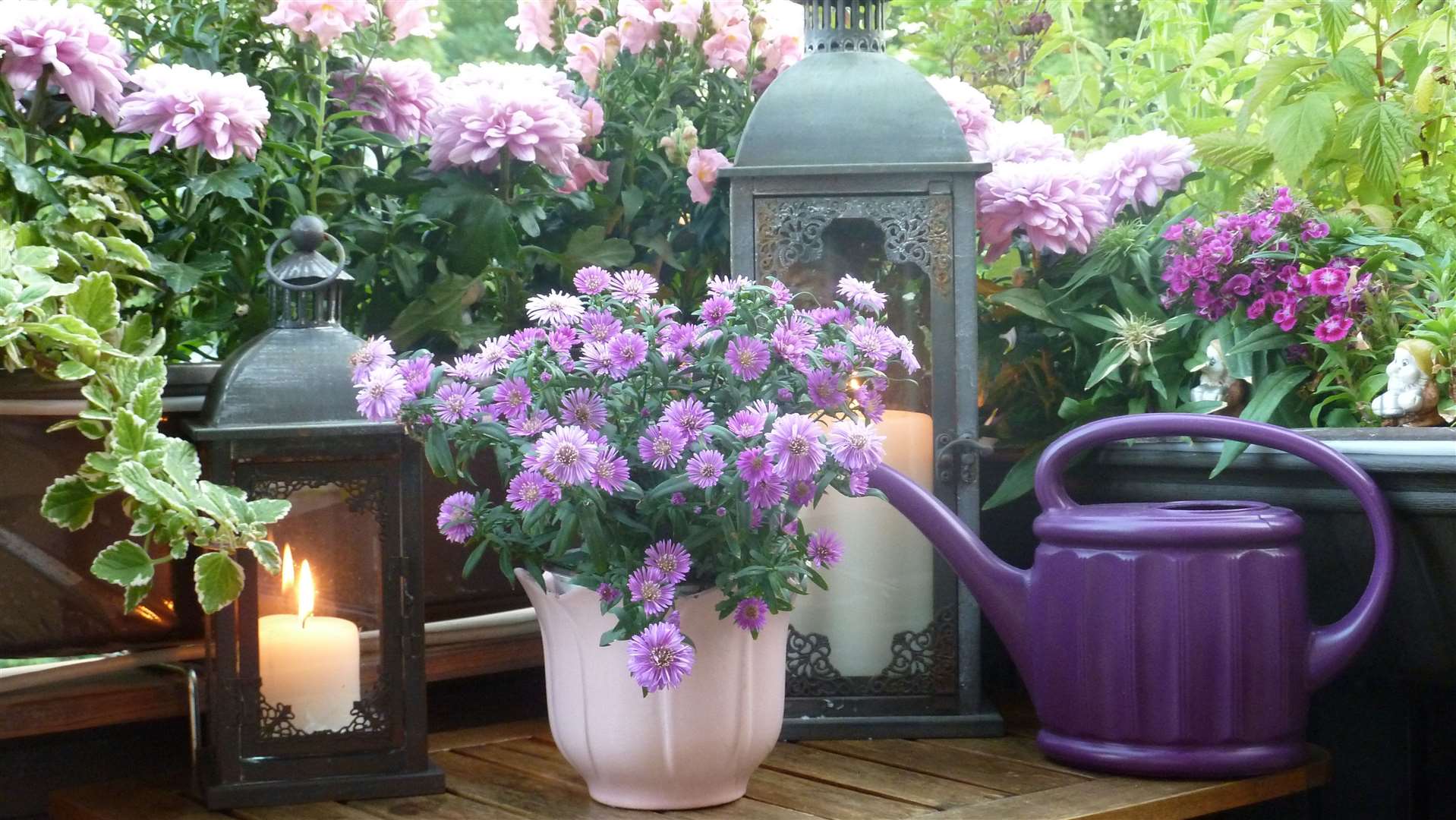 Extend your colour theme to include ornaments and garden furniture as well as plants and flowers.