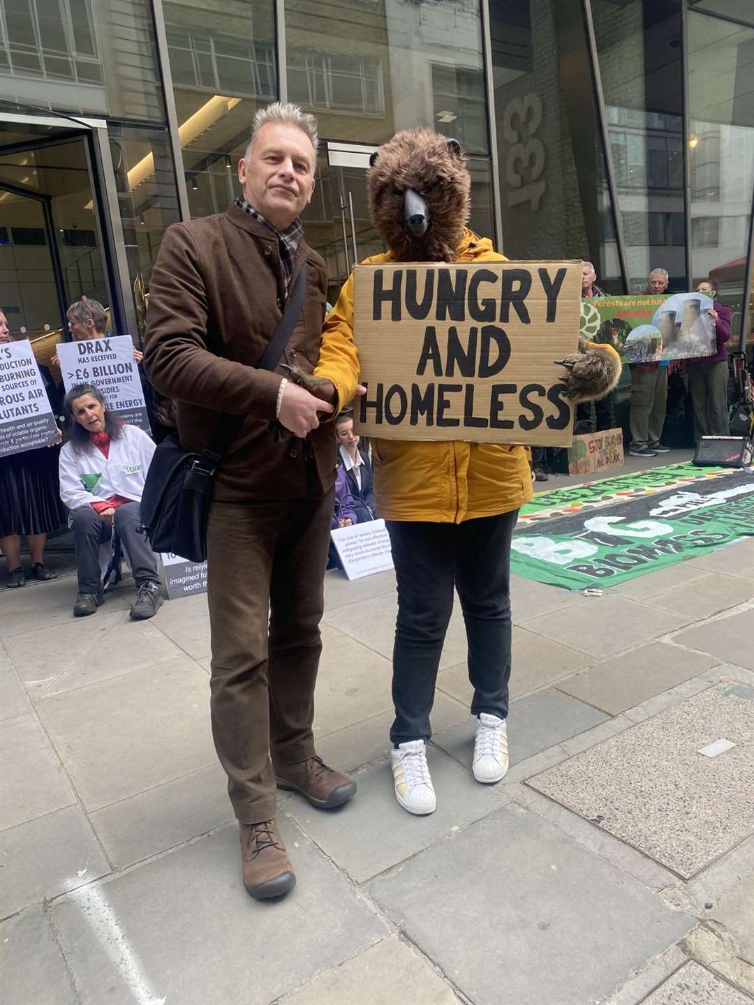 Chris Packham and members of the Axe Drax campaign group outside the Drax AGM in the City of London (Merry Dickinson/PA)