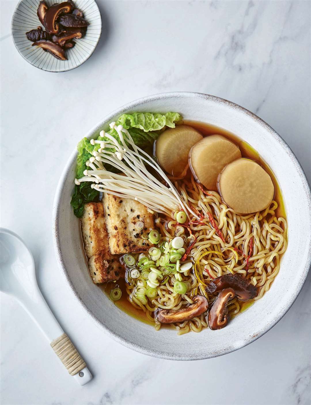 Ramen for Faye Wong – mushroom dashi ramen with vegetables and fried tofu – from Vegan Japaneasy by Tim Anderson.Picture: Hardie Grant/Nassima Rothacker/PA