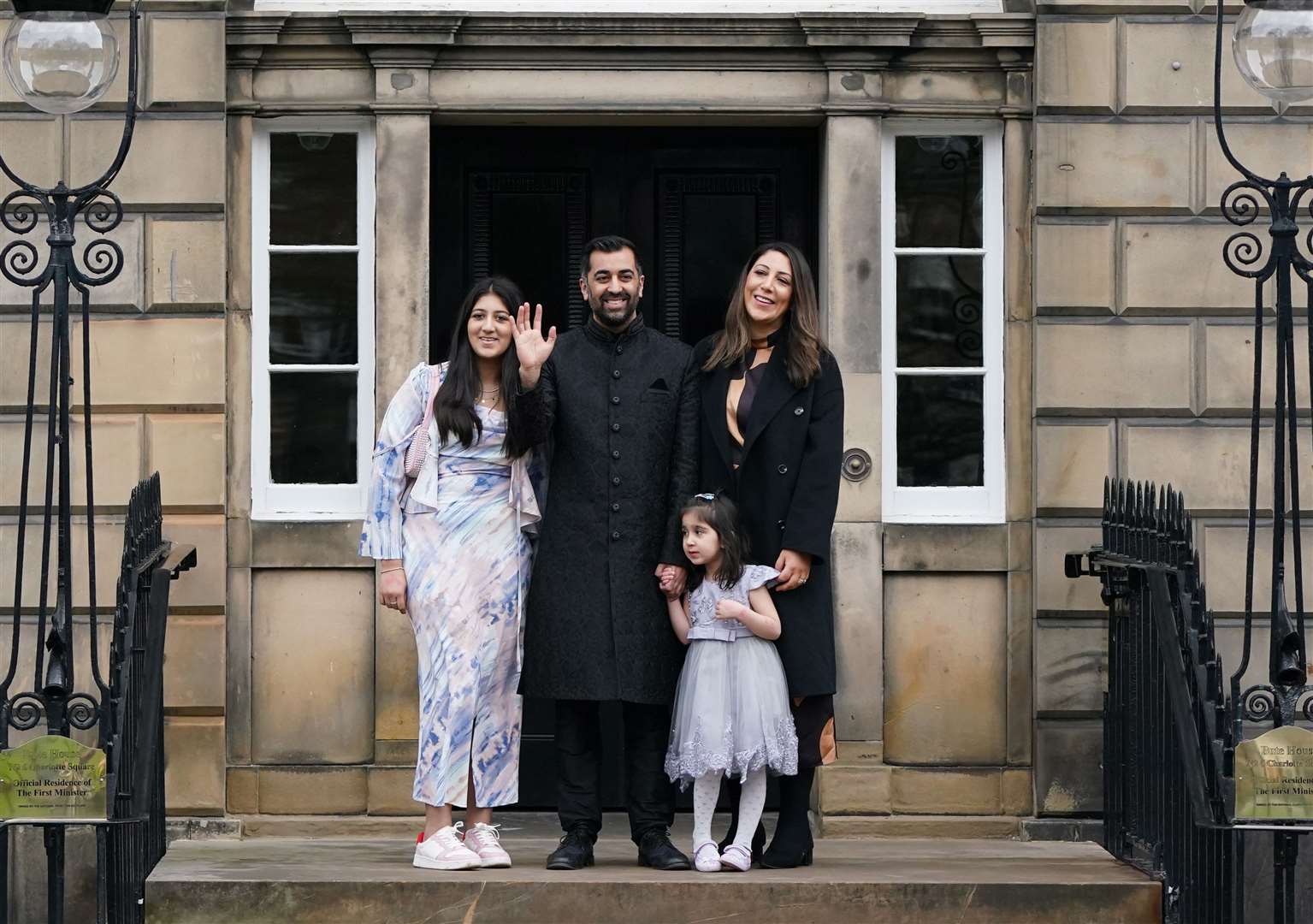 Humza Yousaf and his family on the steps of Bute House as he entered the top job in Scottish politics (Andrew Milligan/PA)