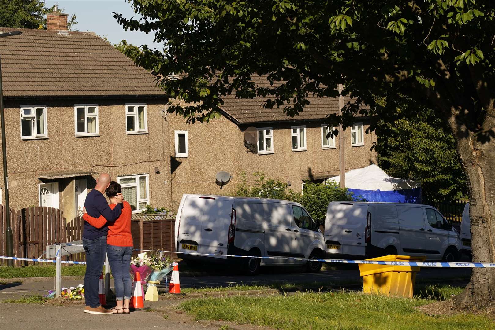 The father to some of the victims left flowers at the scene in Chandos Crescent (Danny Lawson/PA)
