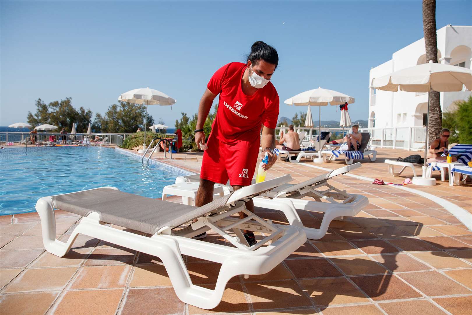 Attendants cleaning sun loungers at the TUI Aura Blue resort. Picture: PA Photo/Ben Queenborough/PinPep