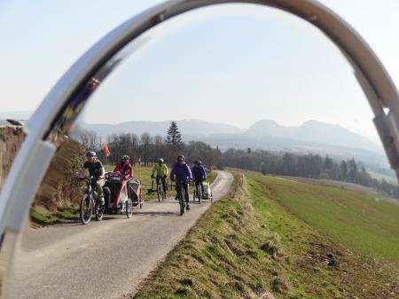 The Supermums group – which includes dads too – cycle along the quiet road from Brahan in the sunshine.