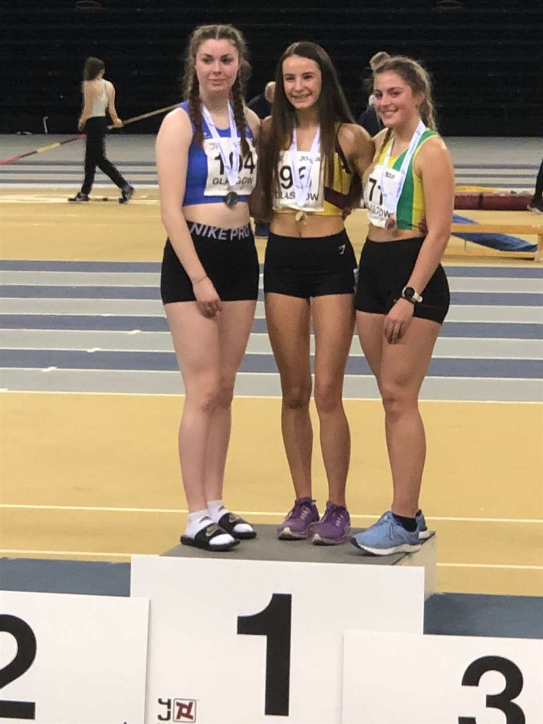 Inverness Harrier Stroma Fraser (centre) won a gold medal at the Indoor National Combined Events Championships in January 2022.