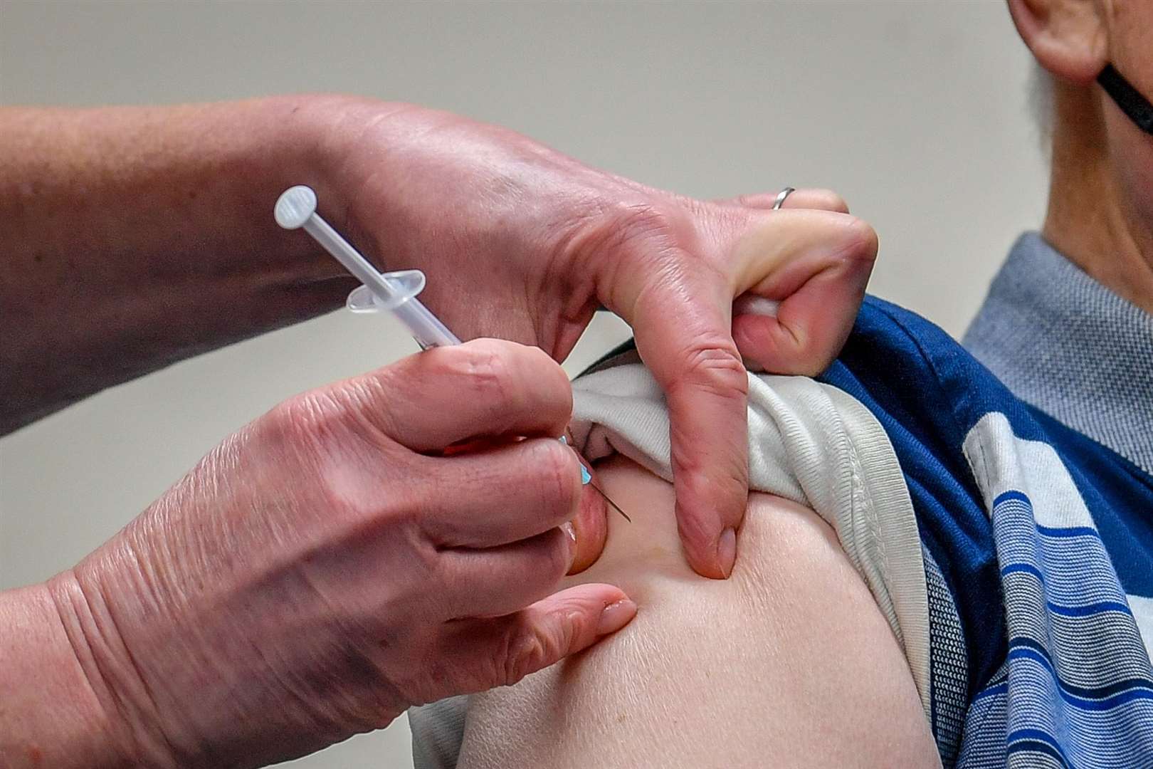 The Oxford University/AstraZeneca vaccine is given to a patient (Ben Birchall/PA)
