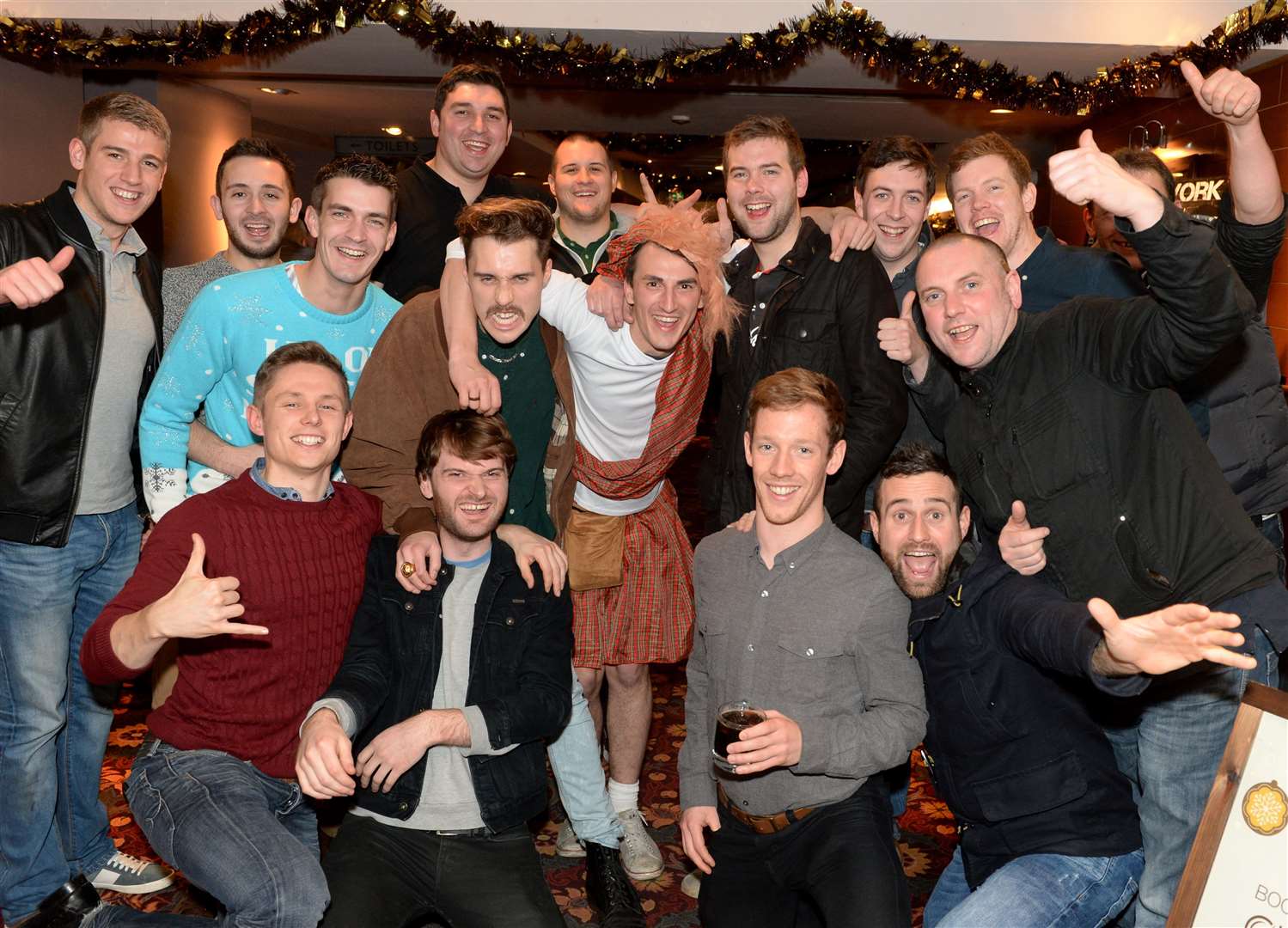 Joe Hall (centre, tartan) enjoys his stag night with mates. Picture: Gary Anthony.