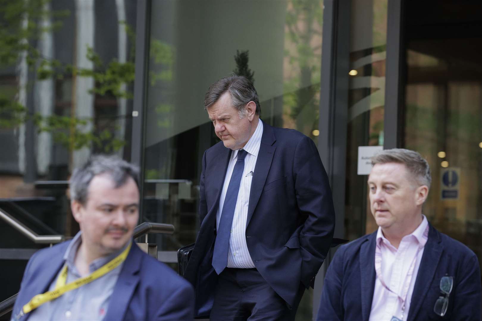 Chris Stewart (centre), leaves the Clayton Hotel in Belfast after giving evidence at the UK Covid-19 Inquiry (Liam McBurney/PA)