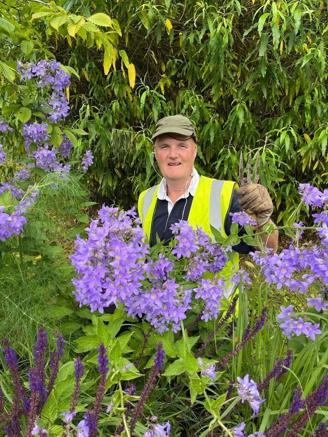 John Walmsley happy at his voluntary work in the UHI Inverness gardens.