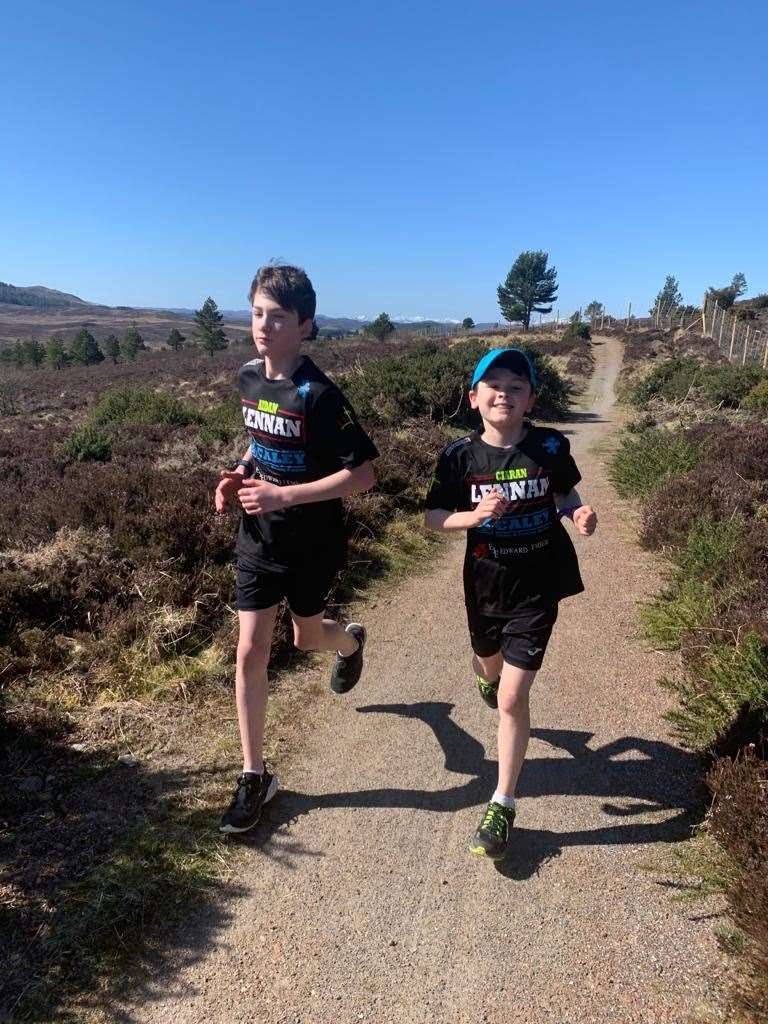 Aidan Lennan (12) and his nine-year-old brother Ciaran of Brudes Hill who ran the equivalent of a marathon over four days in aid of NHS Highland.
