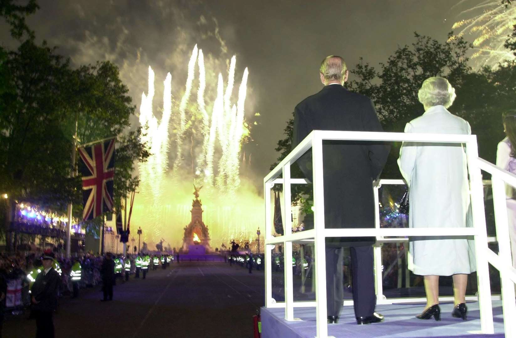 The Queen and Philip watch fireworks over Buckingham Palace during the Golden Jubilee celebrations of 2002 (John Stillwell/PA)