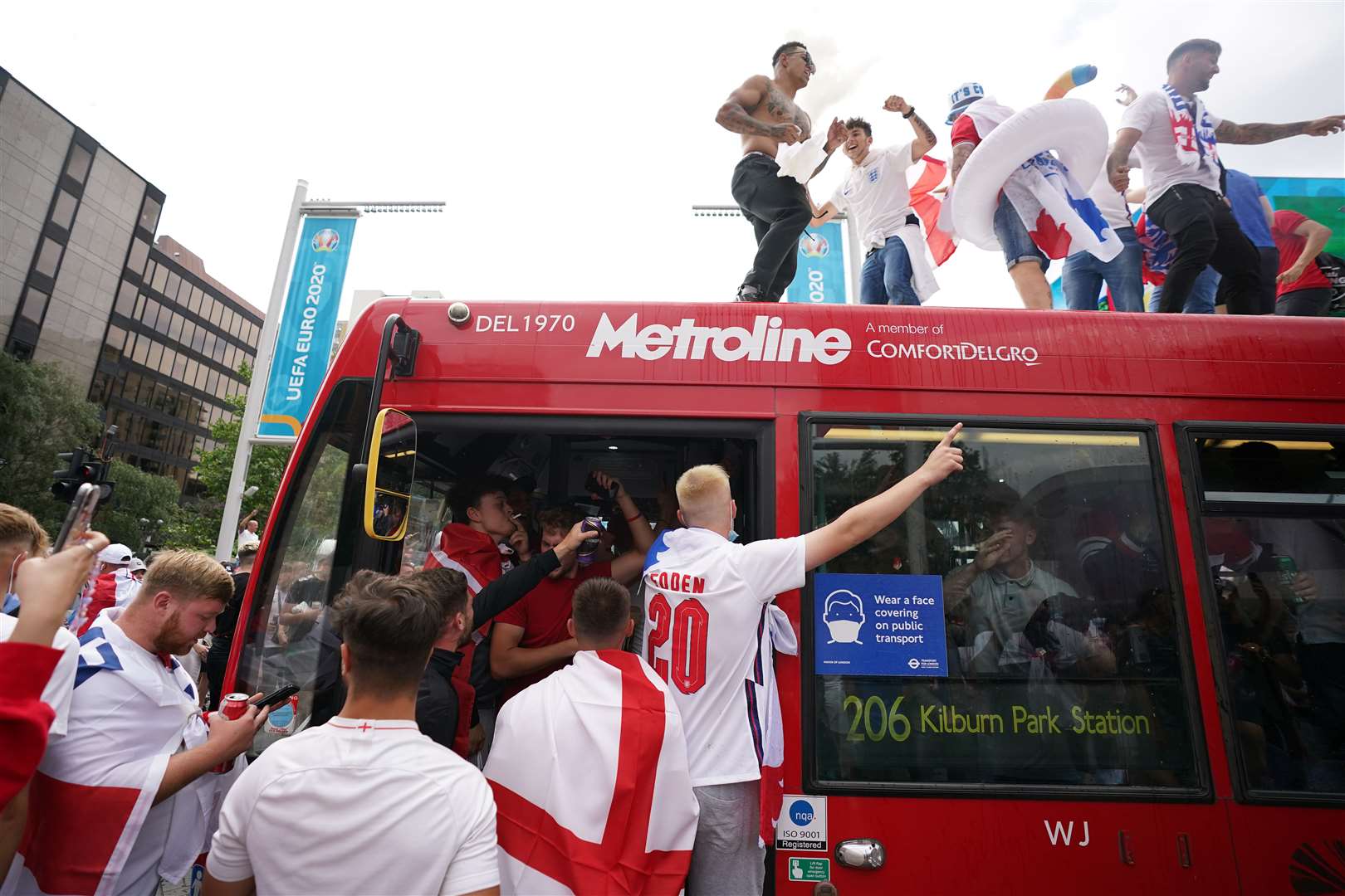 England fans climb aboard a bus near the ground (Zac Goodwin/PA)