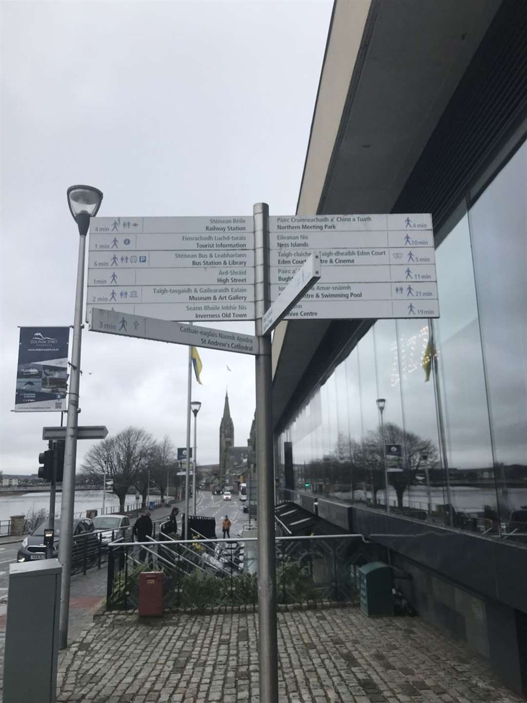 Signs pointing people in the wrong direction to the bus and train station.