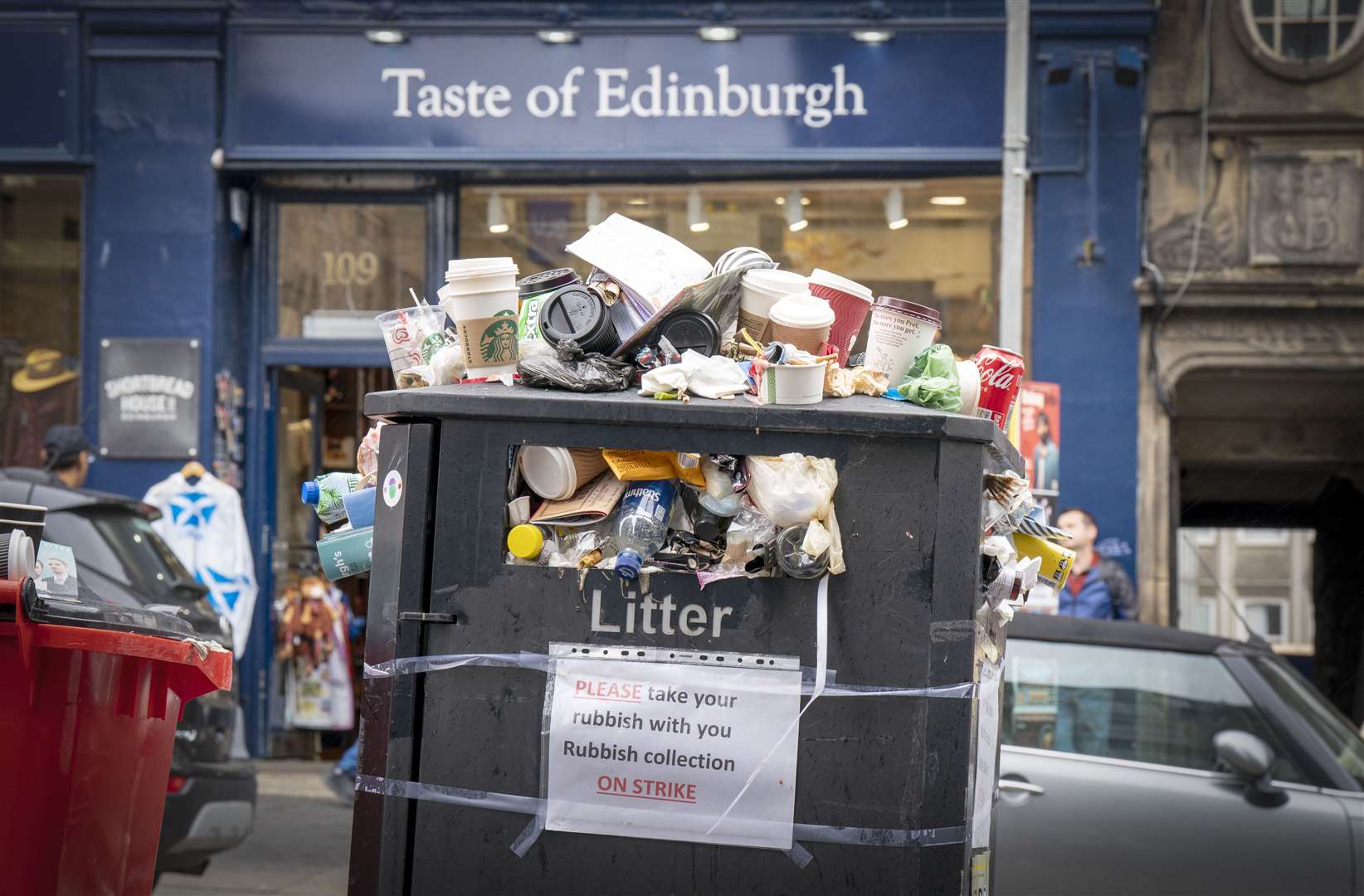 Bins and litter along the Canongate in Edinburgh city centre (Jane Barlow/PA)