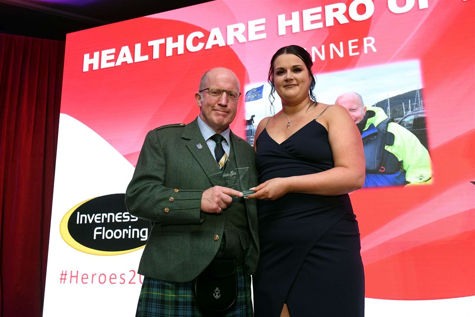 Andy Kent accepting the Healthcare award from Amber Rickard of Inverness Flooring. Picture: James Mackenzie.