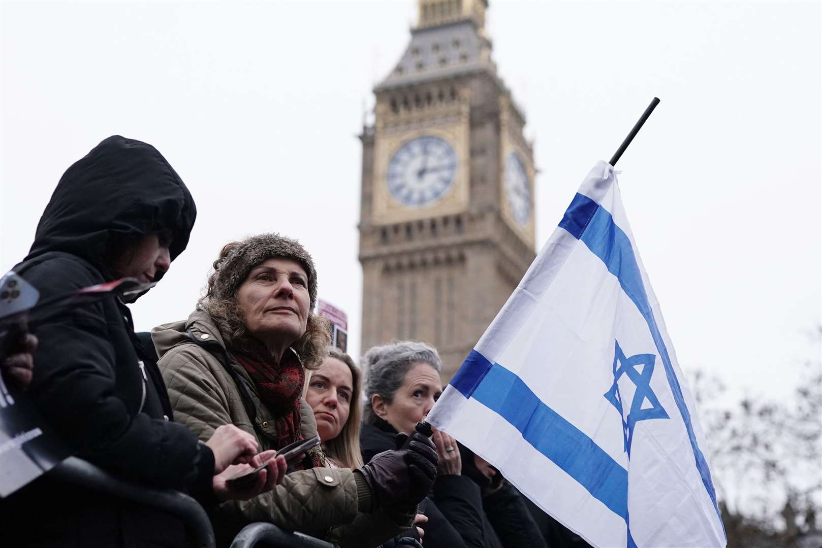 People at the rally waved Israeli and Union flags (Jordan Pettitt/PA)