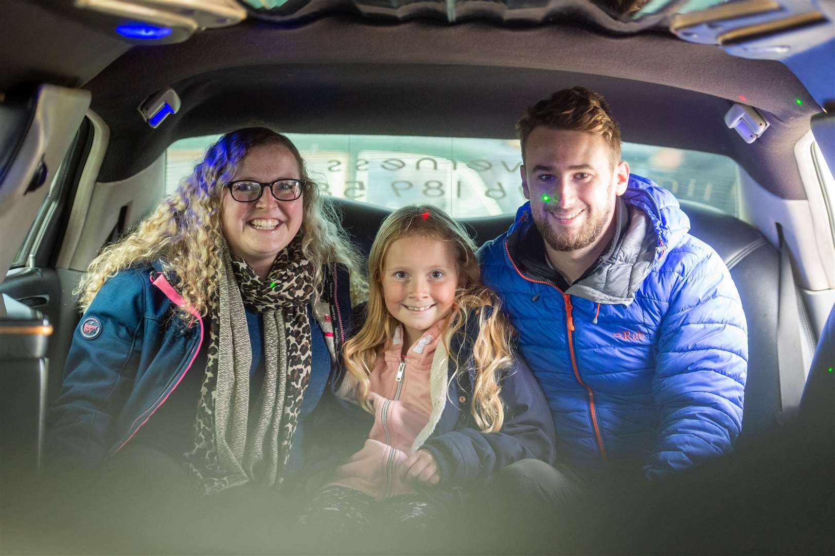 Kayleigh and Molly Taylor with David Mcphail try out the weeding limo. Picture: Callum Mackay..