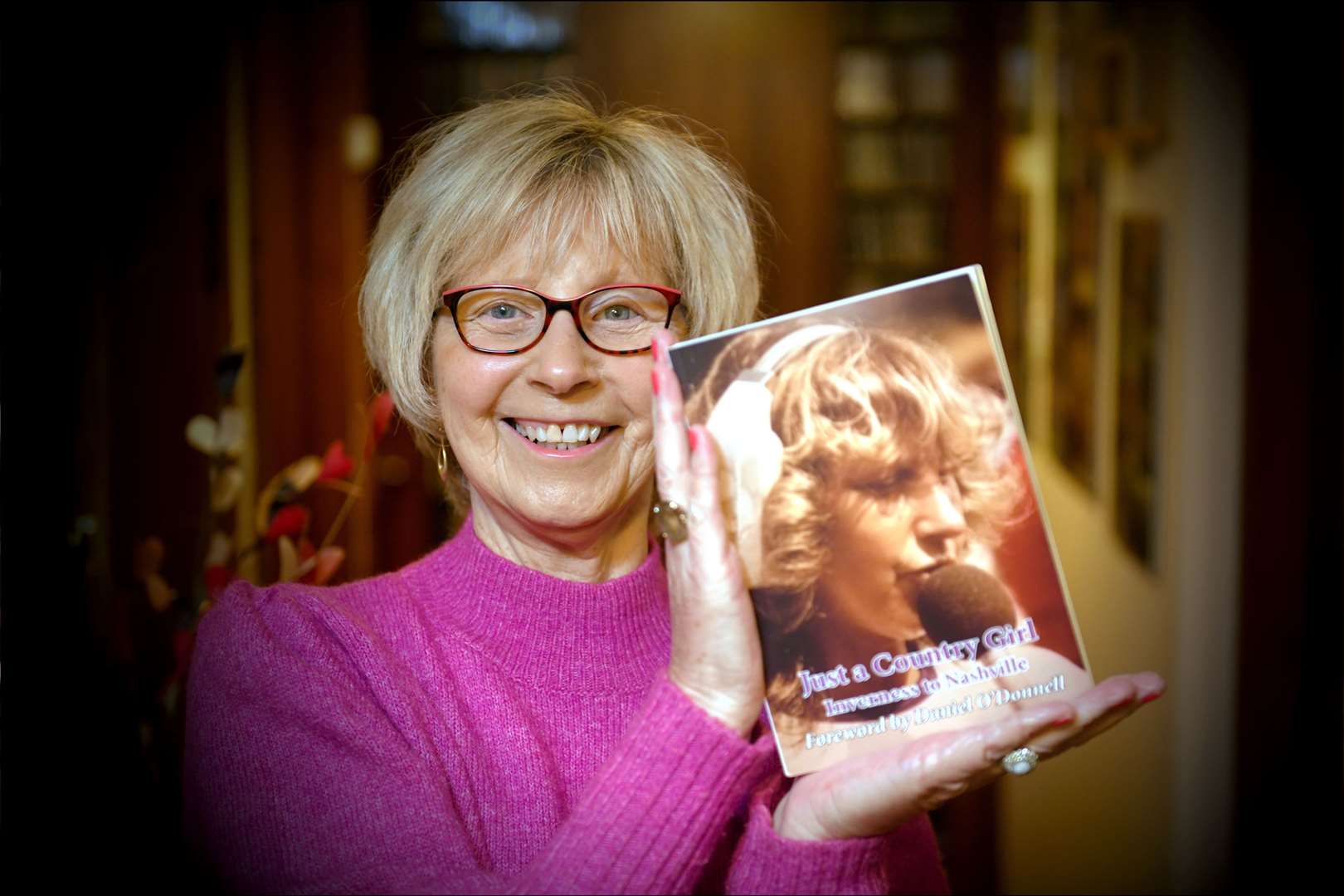 Helen MacPherson holding her book. Picture: James Mackenzie