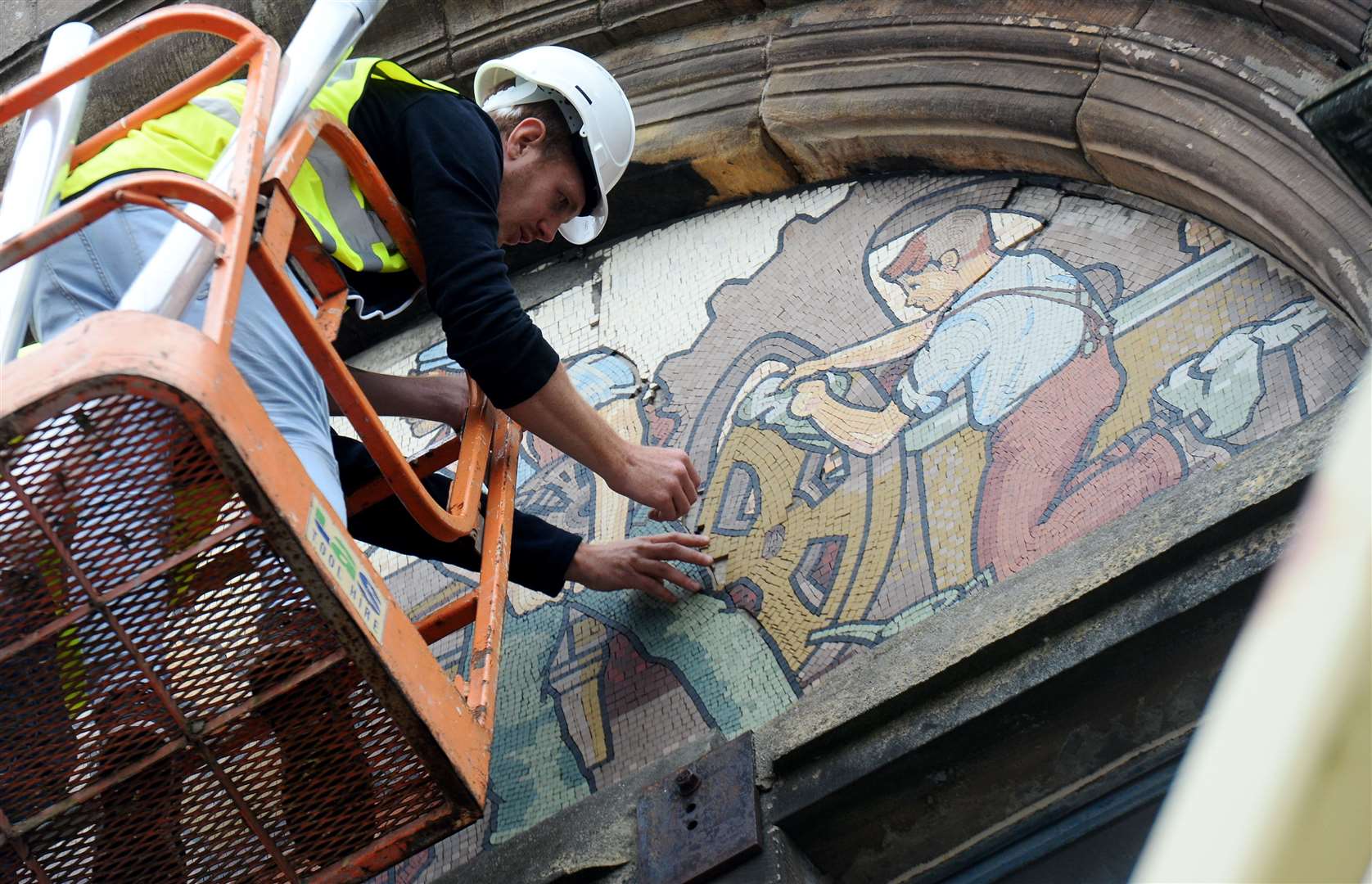 The restoration of the mosaics on the former AI Welders building was part of a flagship project in the drive to regenerate Academy Street.