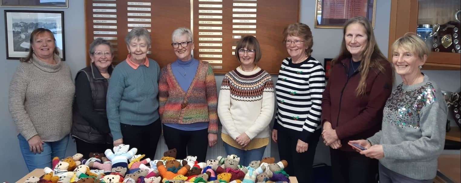 Some of the knitters that created the teddy bears this year.
