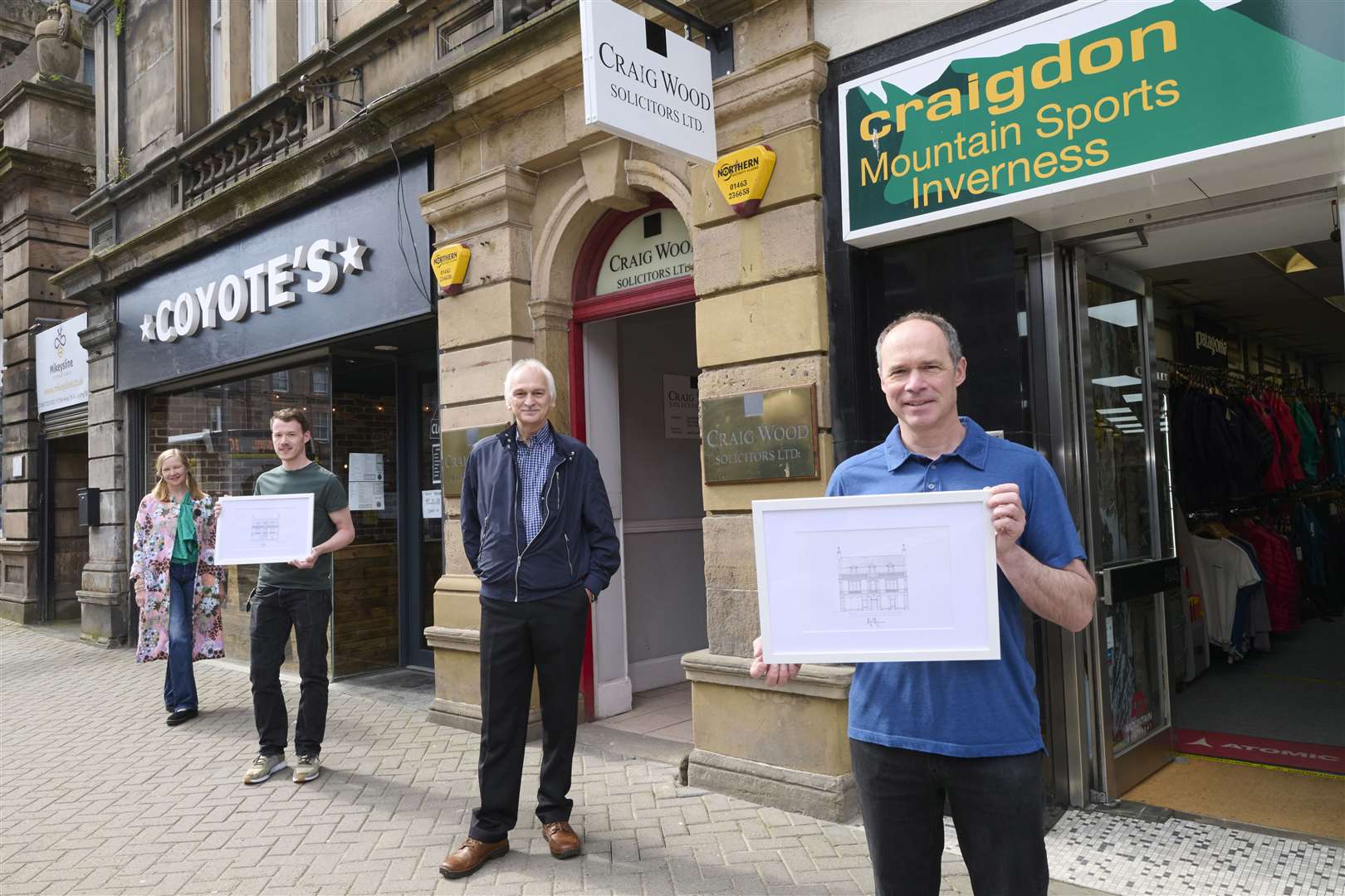 Sarah James-Gaukroger, David Brown, Gordon Lynn and Colin Lyon with the drawings of businesses in Academy Street, Inverness.