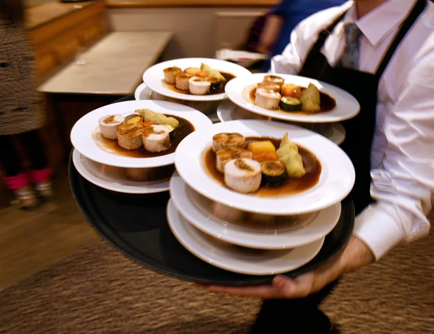Main course being rushed out to the guests. Picture: James Mackenzie.
