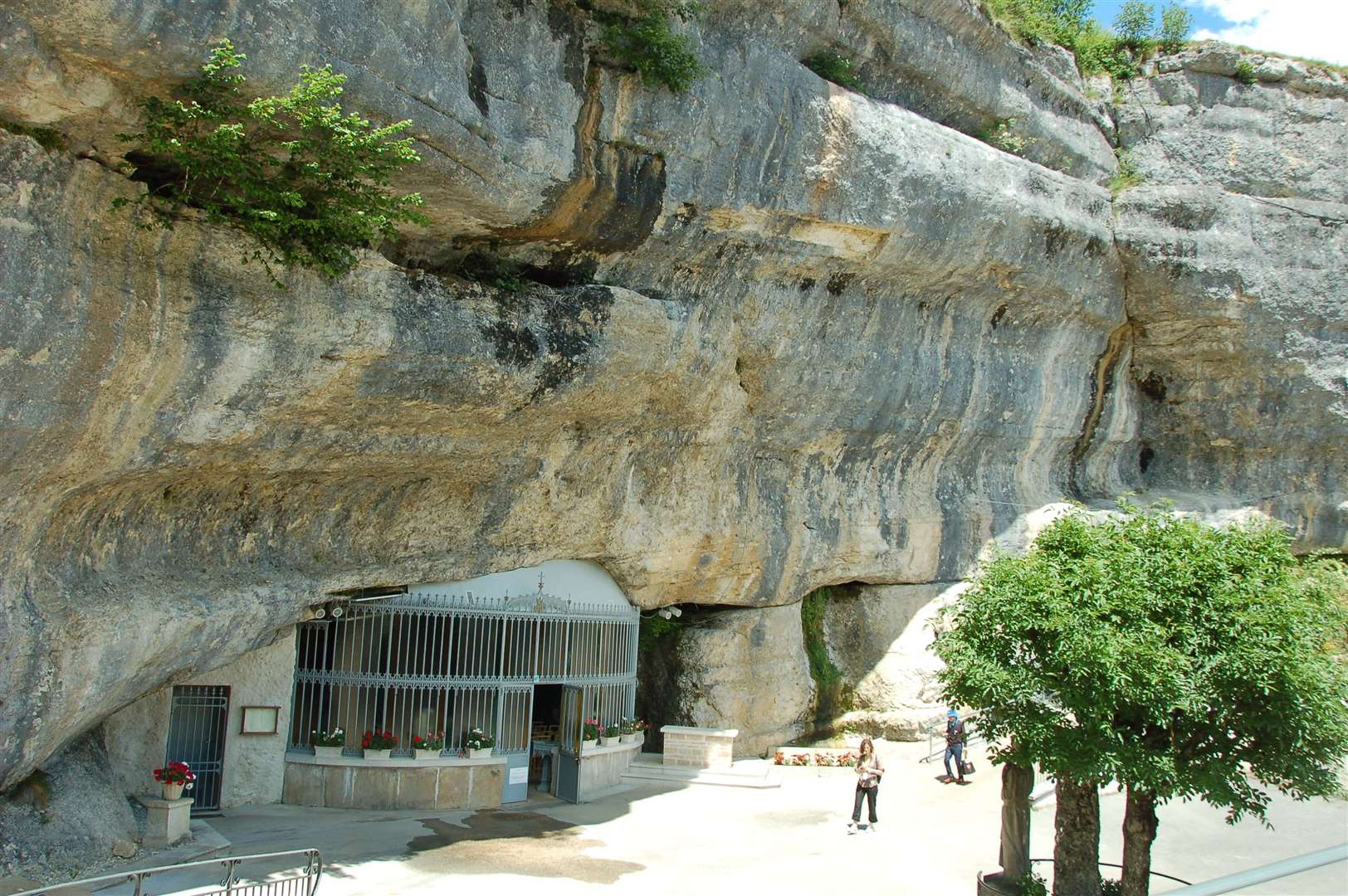 The church built into a cave and water source, Grotte de Remonot, Les Combs.