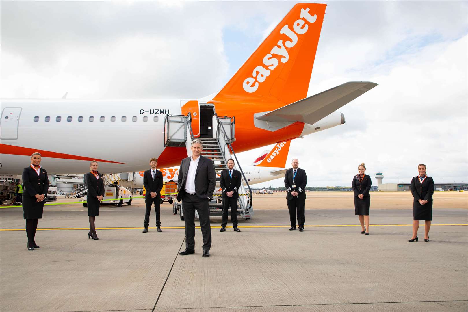 Johan Lundgren and cabin crew at Gatwick Airport (David Parry/PA)