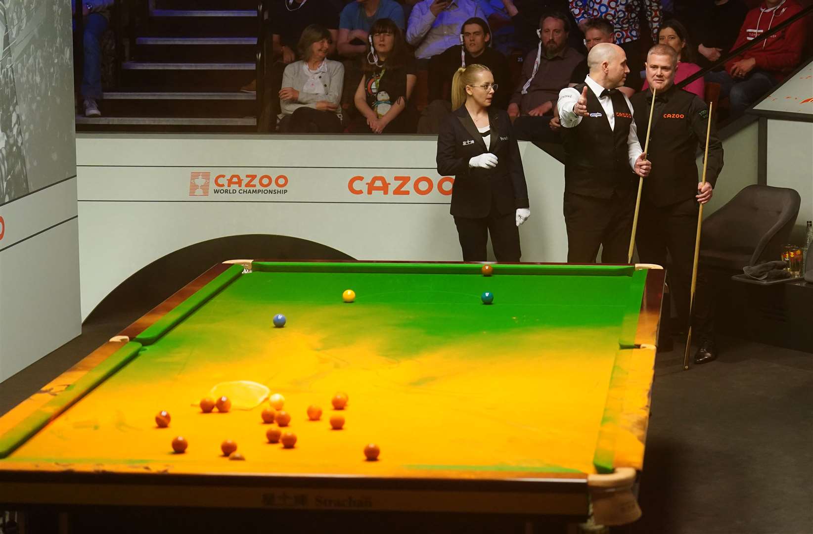 Orange powder on the table after a Just Stop Oil protester jumped on it during a match between Robert Milkins against Joe Perry at the Crucible (PA)