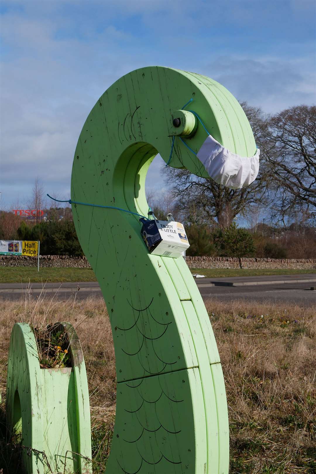 Loch Ness Monster wearing face mask in Dores Road, Inverness.