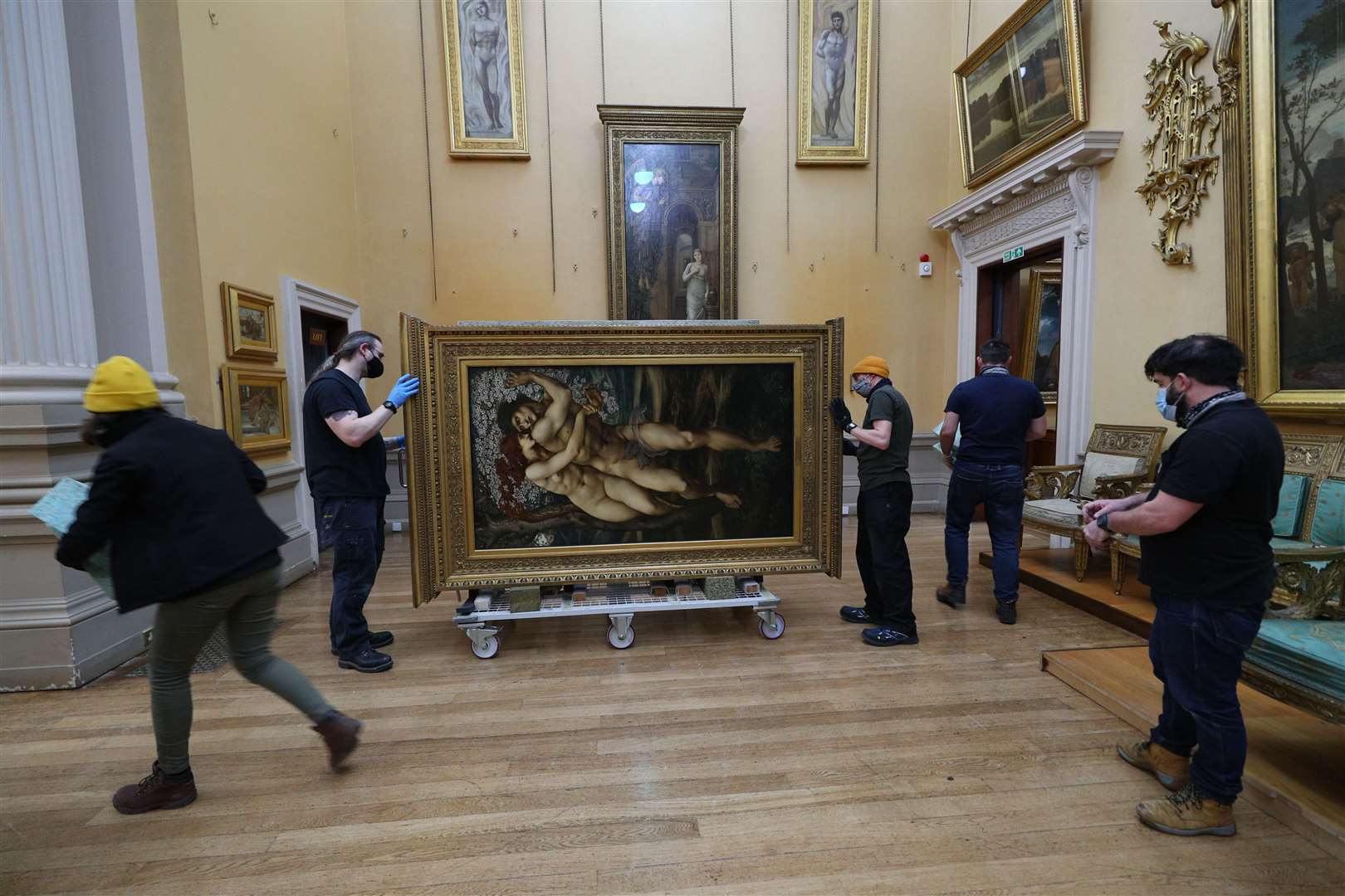 The Beguiling of Merlin by Edward Burne-Jones is prepared for hanging at the Lady Lever Art Gallery (Peter Byrne/PA)