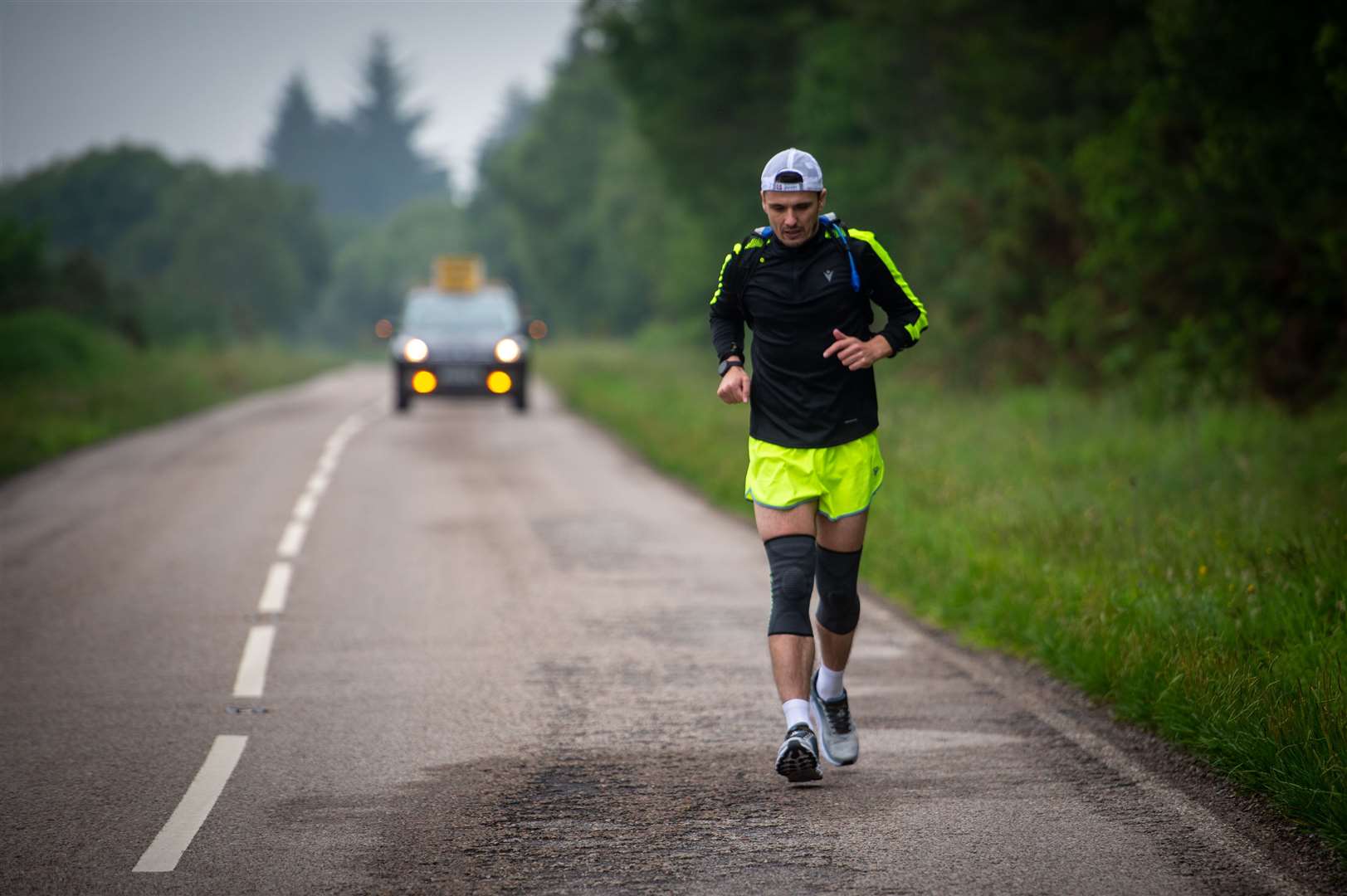 The Brora Rangers Team manager, Steven Mackay ran an ultra marthon of 80 miles in 24hrs to raise money for MFR cash for kids with the support of Craig Campbell and David Hind...On the last marathon of three just outside Bonar Bridge...Picture: Callum Mackay..