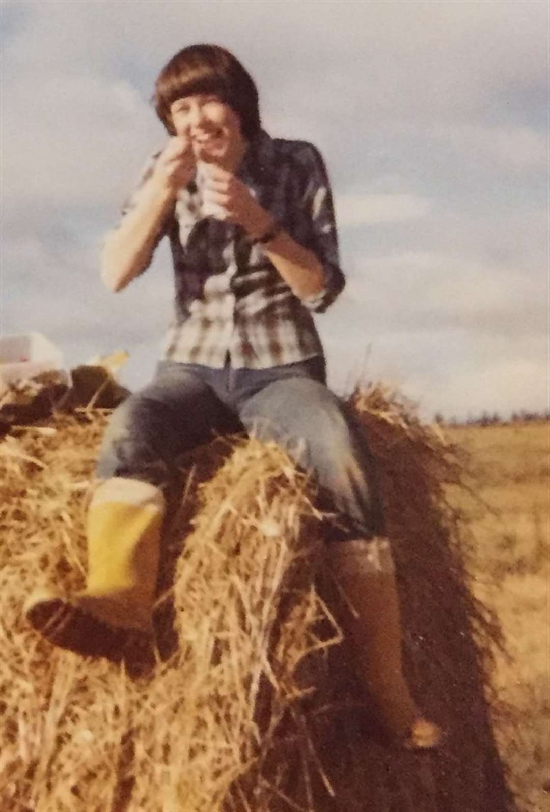 Flashback: Nicky Marr takes a break on the hay bales during the tattie holidays back in the 1980s.