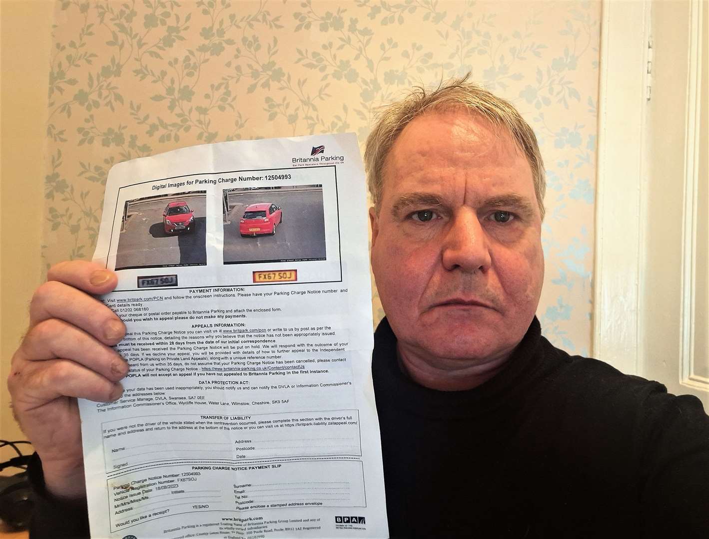 David Scott with the parking fine he received.