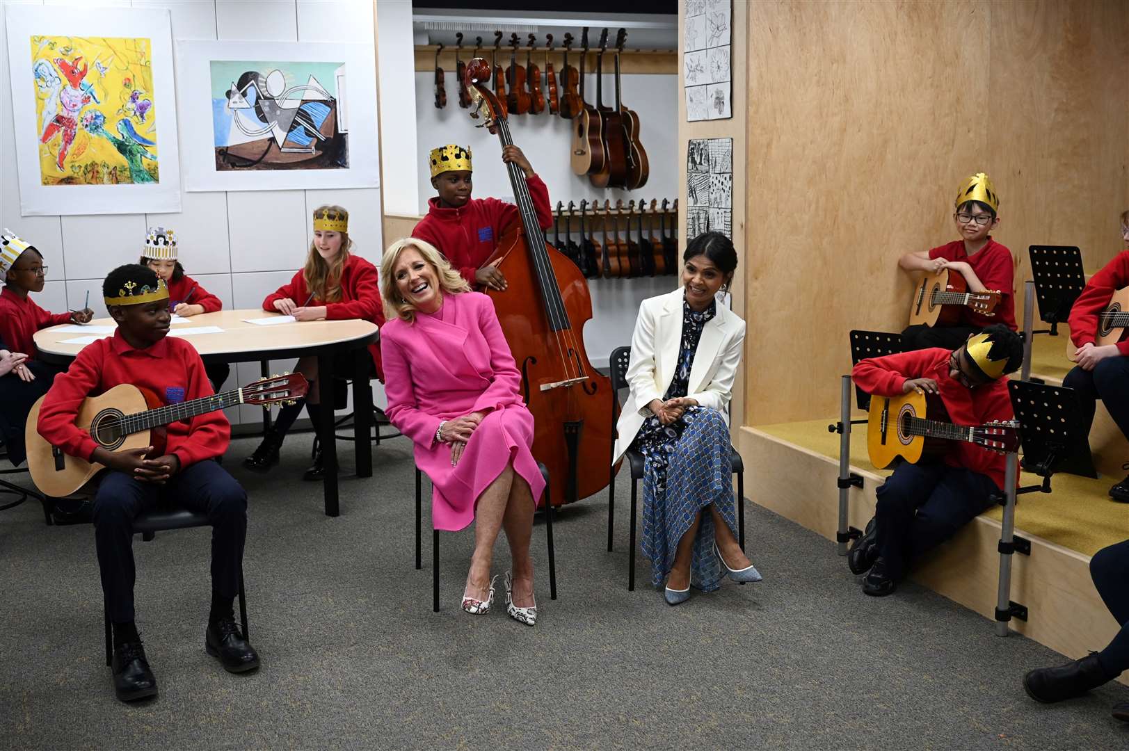 Jill Biden and Akshata Murty listen to a music class at Charles Dickens Primary School (Oli Scarff/PA)