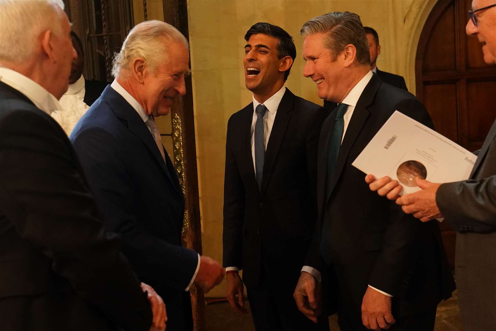 King Charles III speaks with Prime Minister Rishi Sunak and Labour leader Sir Keir Starmer at a coronation reception in Westminster Hall (Arthur Edwards/The Sun/PA)
