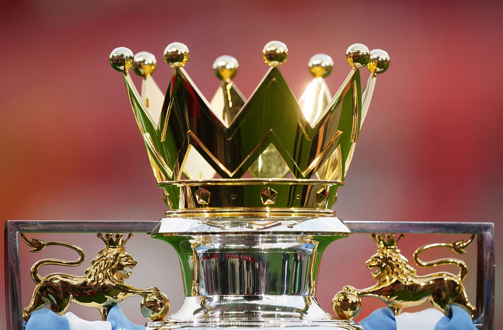 A view of the the Premier League Trophy in Manchester City colours (Mike Egerton/PA)