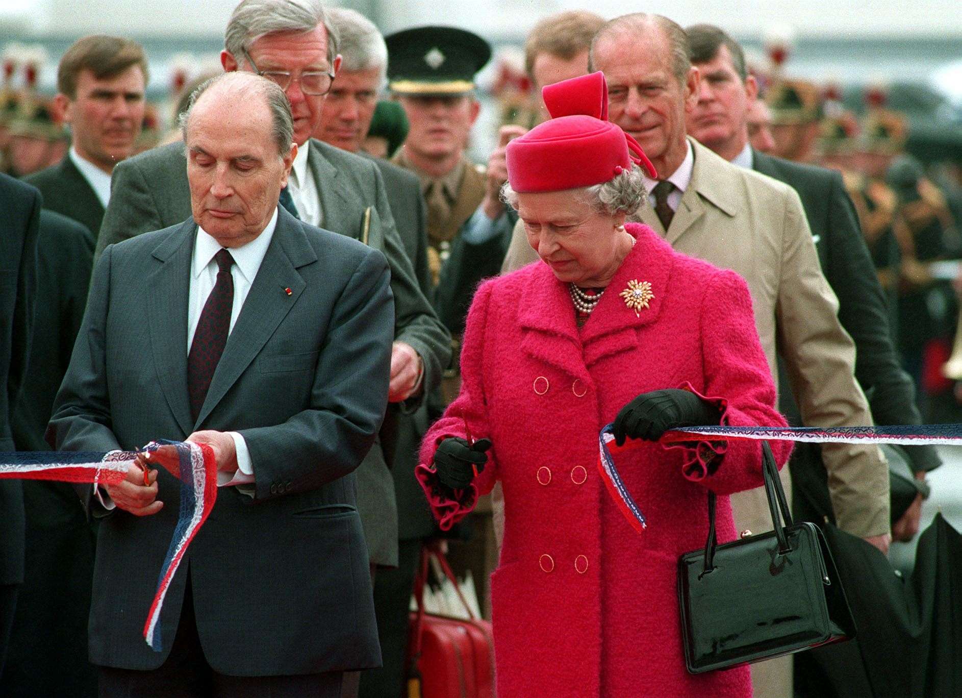 Queen Elizabeth II and then president Francois Mitterrand of France cut the ribbon to officially open the Channel tunnel (Tim Ockenden/PA)