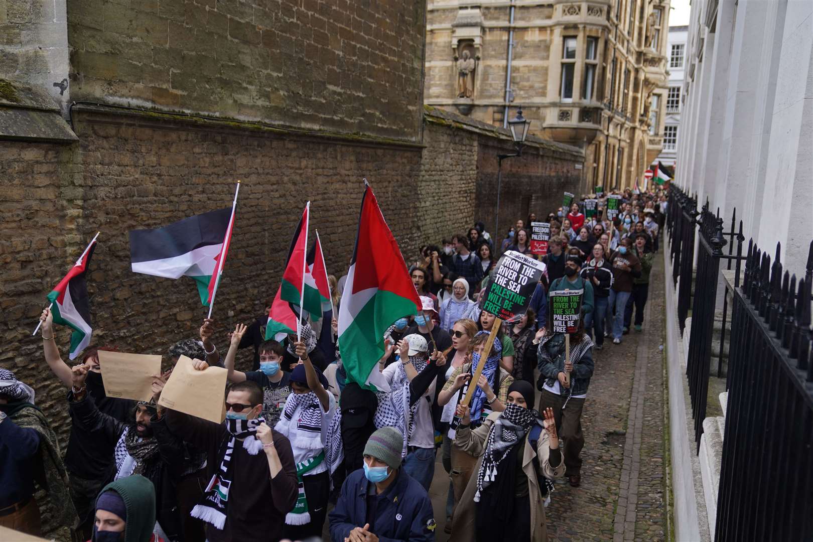 Students marching through Cambridge (Joe Giddens/PA)