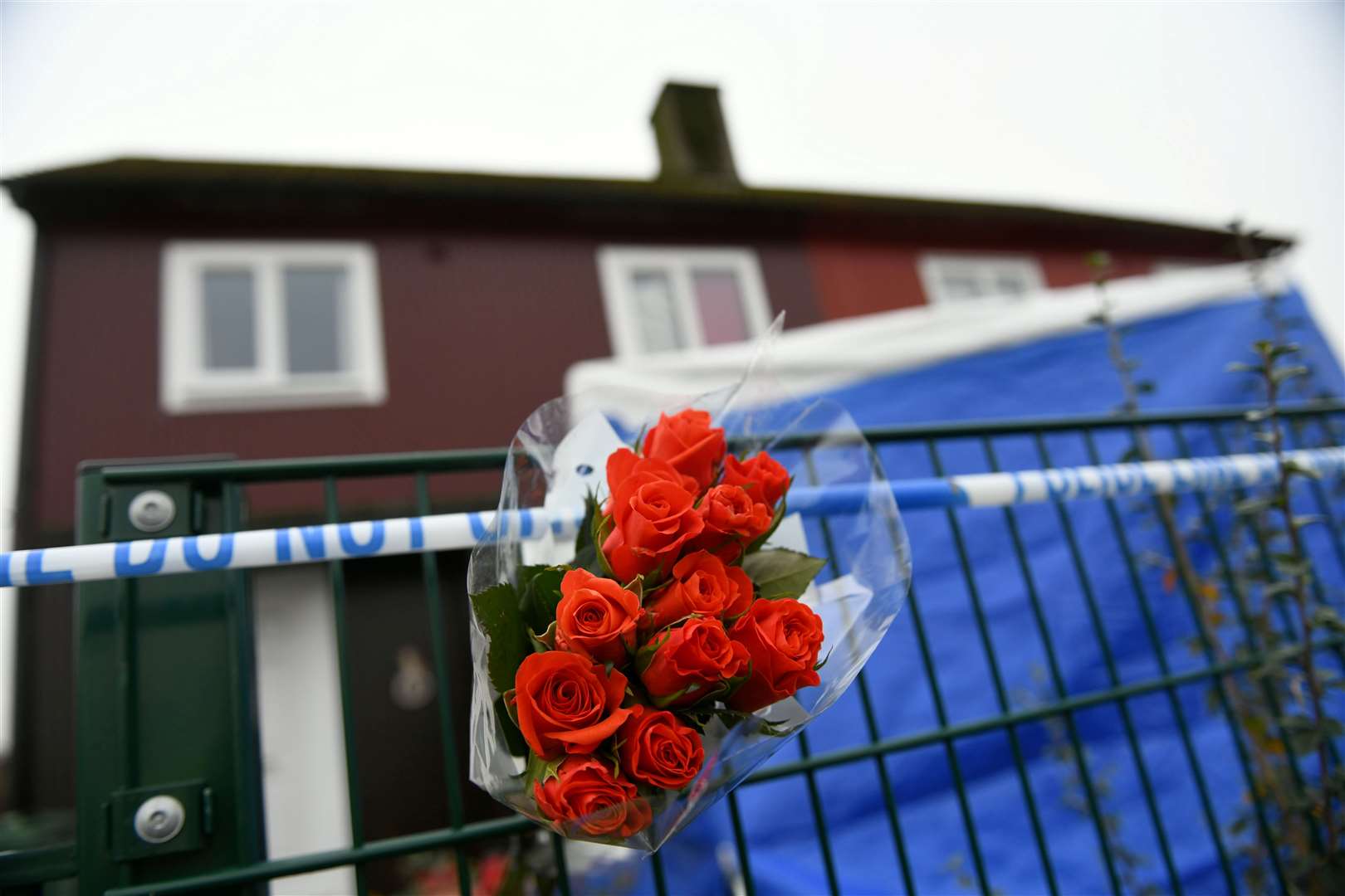 Flowers were placed at the house where Ross MacGillivray died.