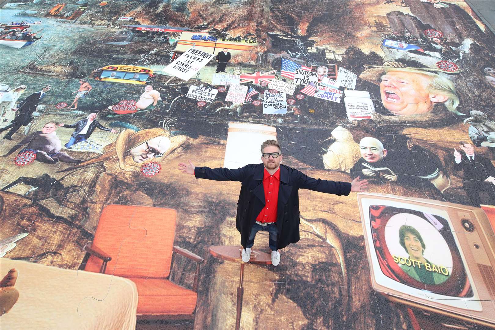 Artist Cold War Steve with his new piece of art, Trumpscape (Danny Lawson/PA)