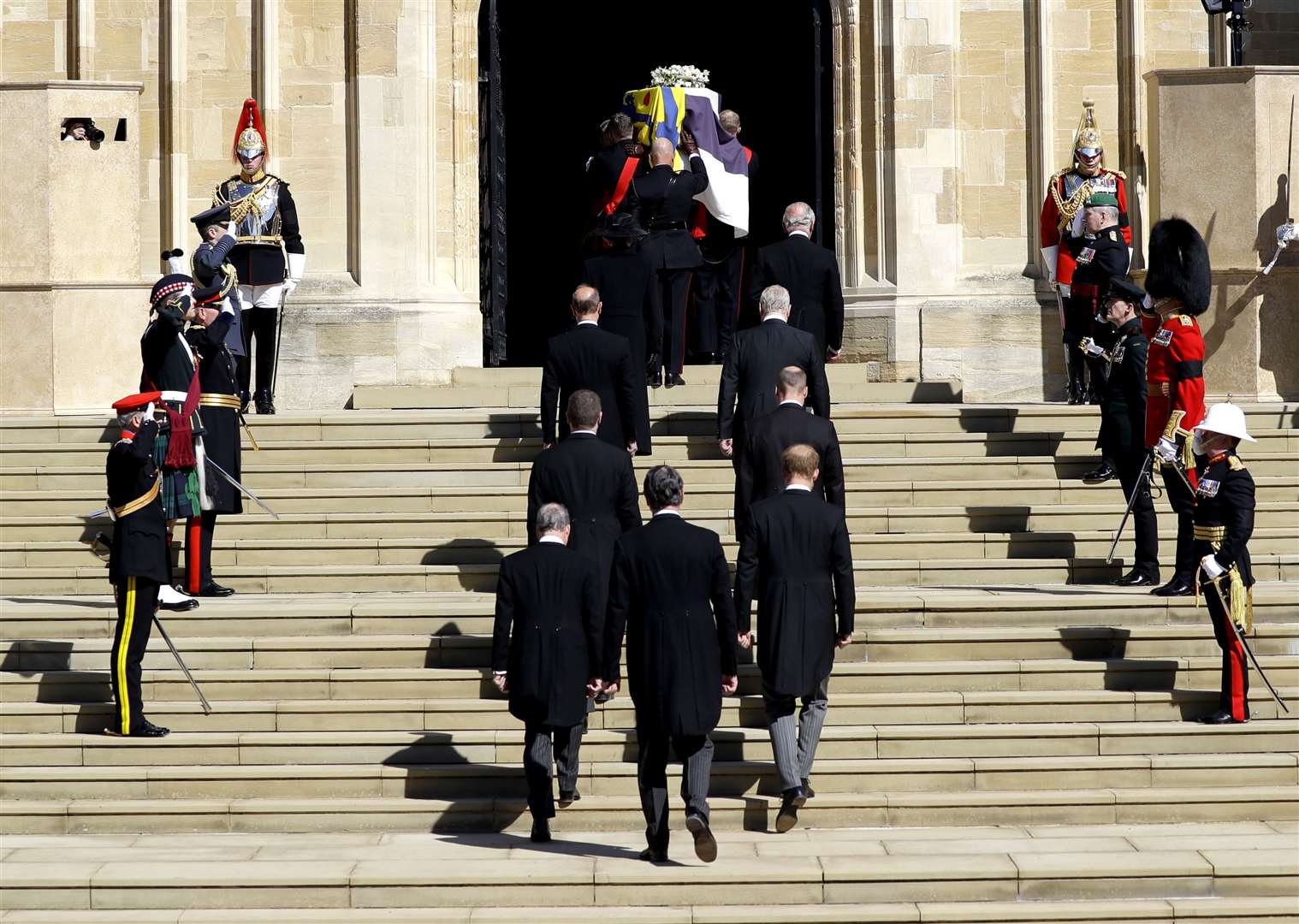 Members of the royal family follow the duke’s coffin into St George’s Chapel (Kirsty Wigglesworth/PA)
