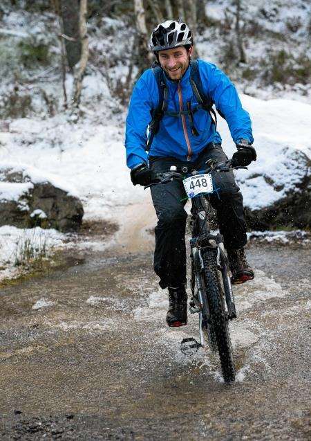 John Davidson splashes through a river during the Strathpuffer at the weekend. Picture: Gary Williamson