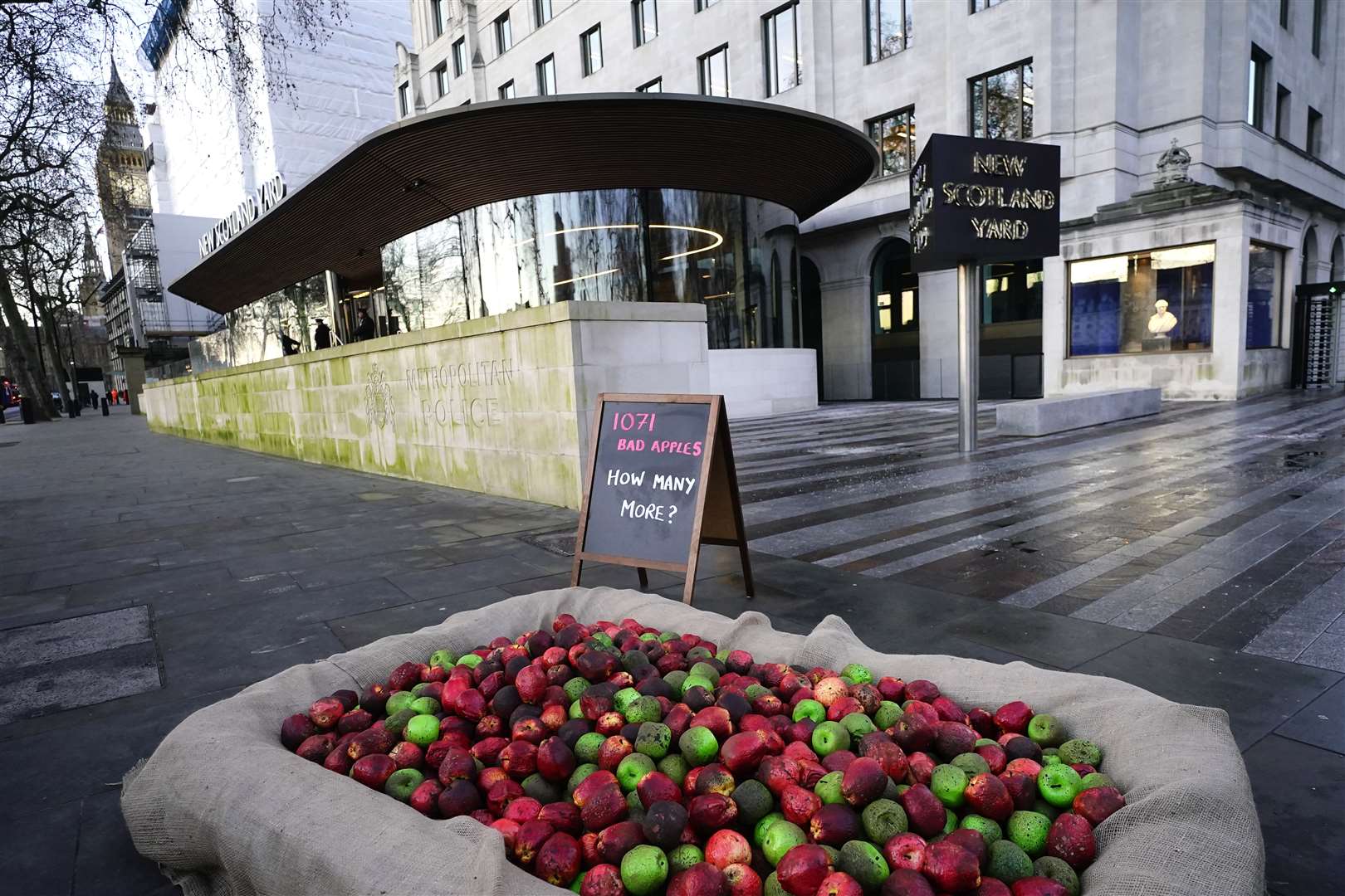 Rotten apples outside New Scotland Yard (Aaron Chown/PA)