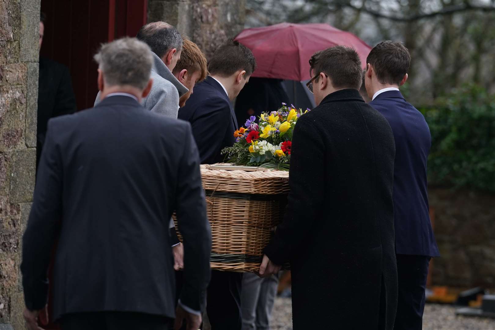 Pall bearers carry the casket into St Ibar’s Church in Castlebridge, Co Wexford (Brian Lawless/PA)