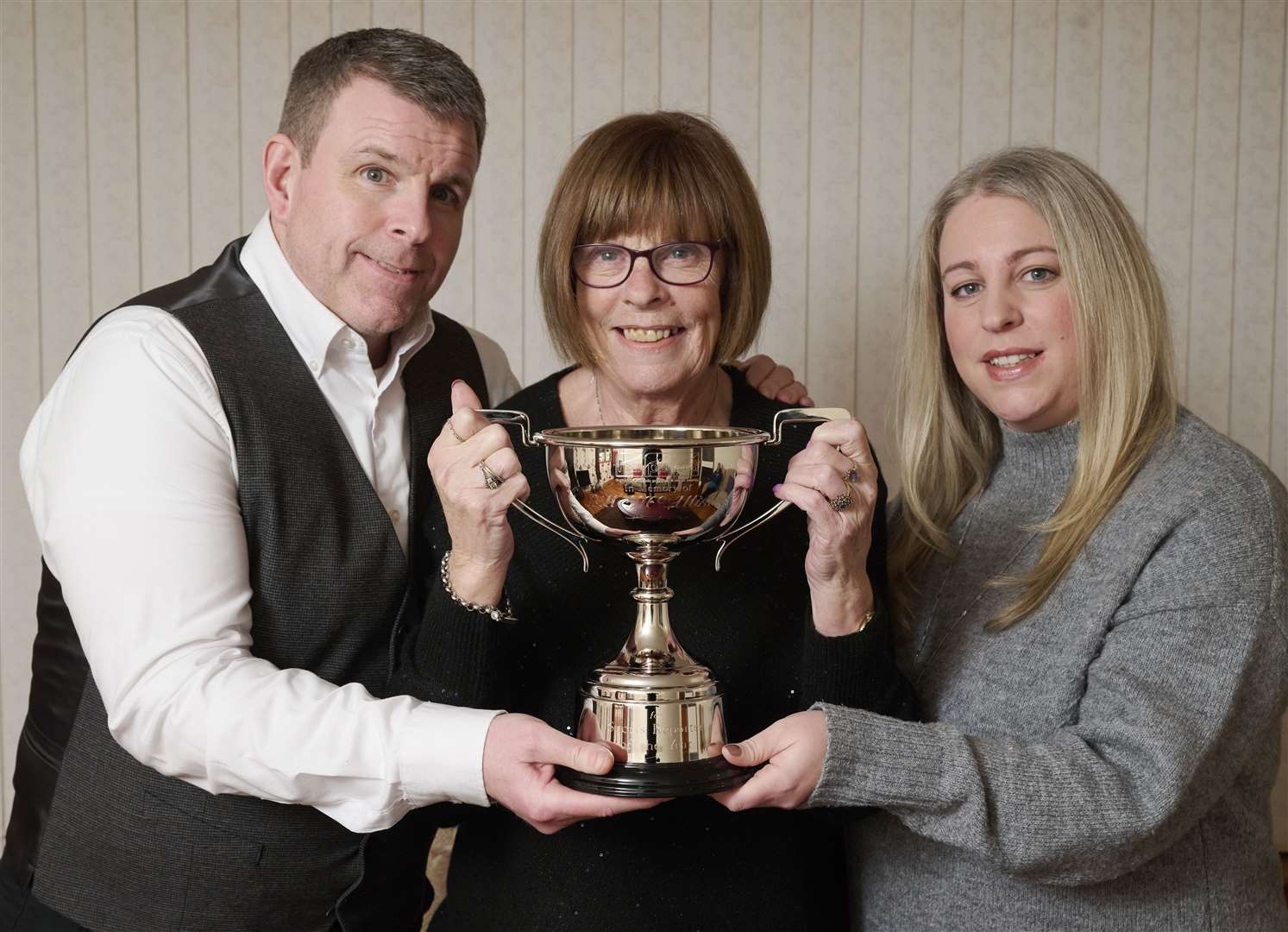 Ker, Bet and Gemma McAllister with the memorial trophy.