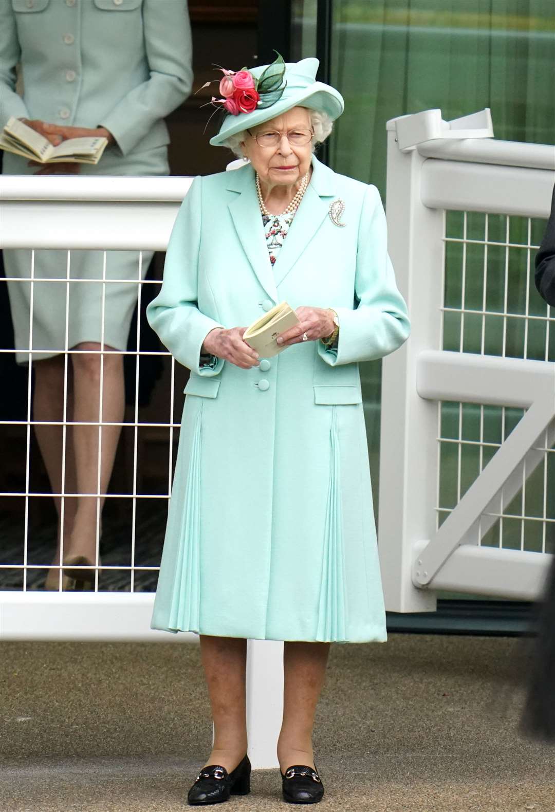 The Queen wore a mint green Angela Kelly coat and matching hat (Andrew Matthews/PA)